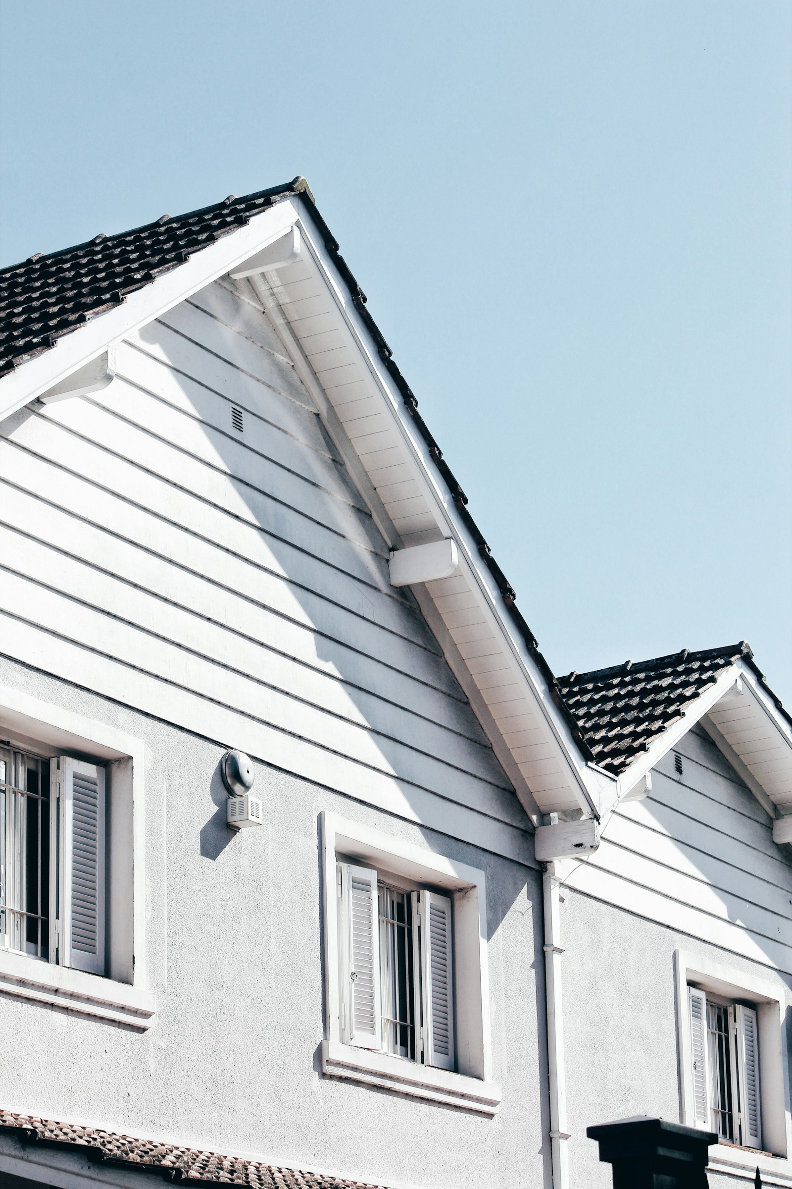 Clean white siding and trim on a finished home exterior