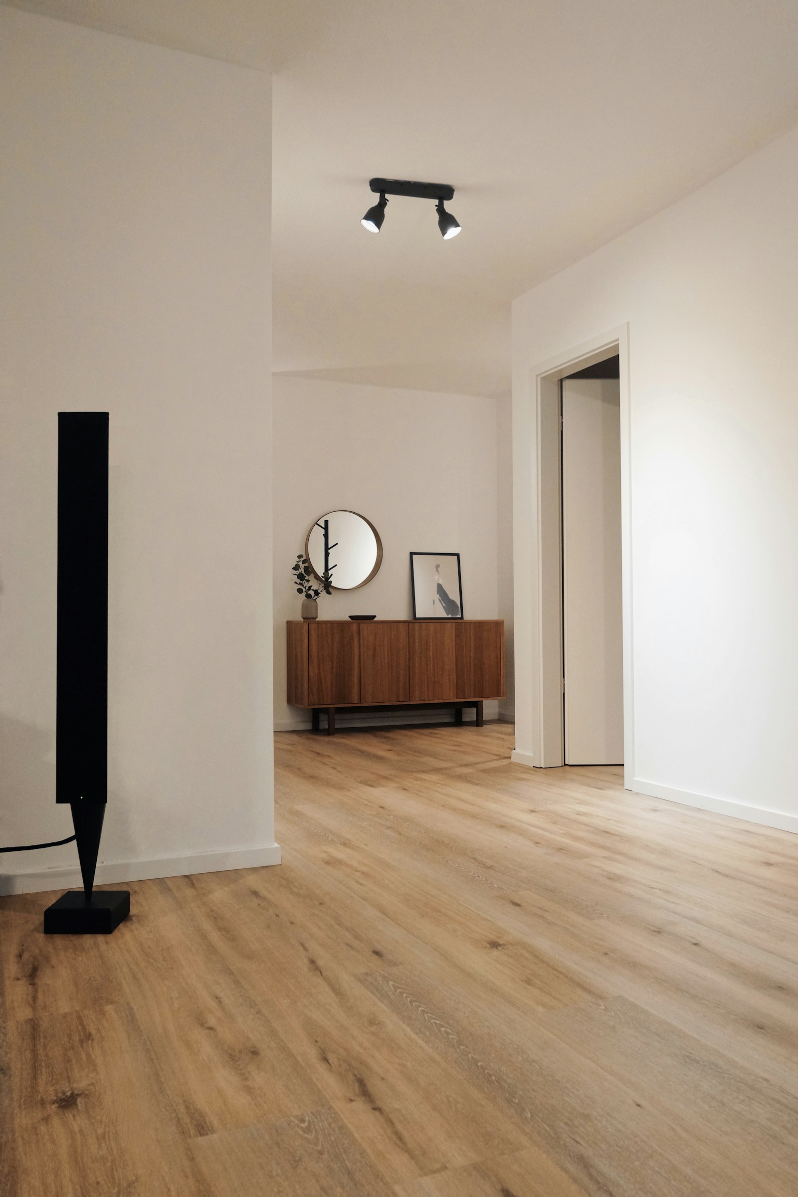 Warm wood plank flooring freshly installed in a bright room